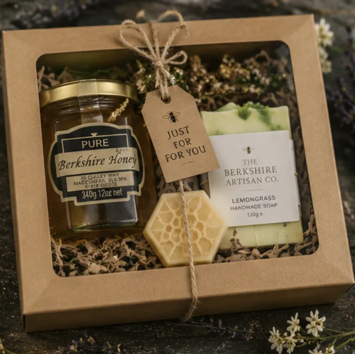 Window gift box with a honey jar, beeswax honeycomb and lemongrass soap, tied with twine